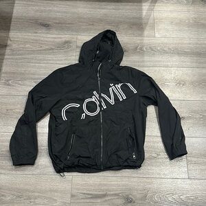 Used Men’s Large Black Calvin Klein Zip Up Hooded Windbreaker.